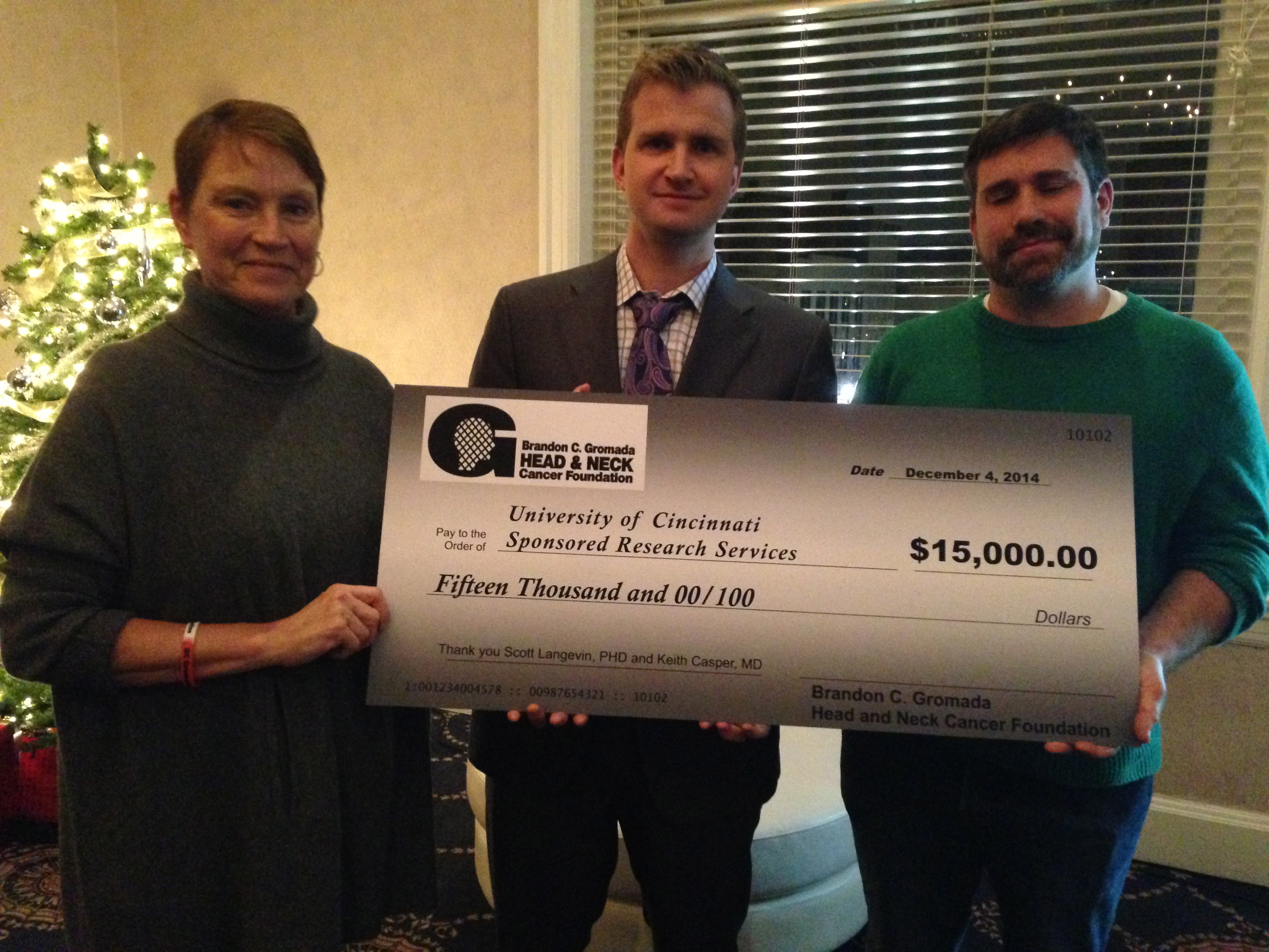 Ceremonial Grant Award Check Presented to UC Researchers